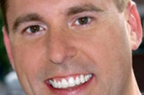 After orthodontic treatment at Elvebak Orthodontics in Plano, TX, with straight and healthy teeth.